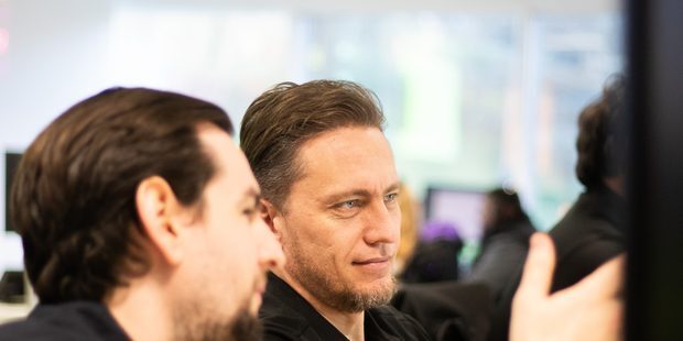 Two Aztech engineers working through a support issue together